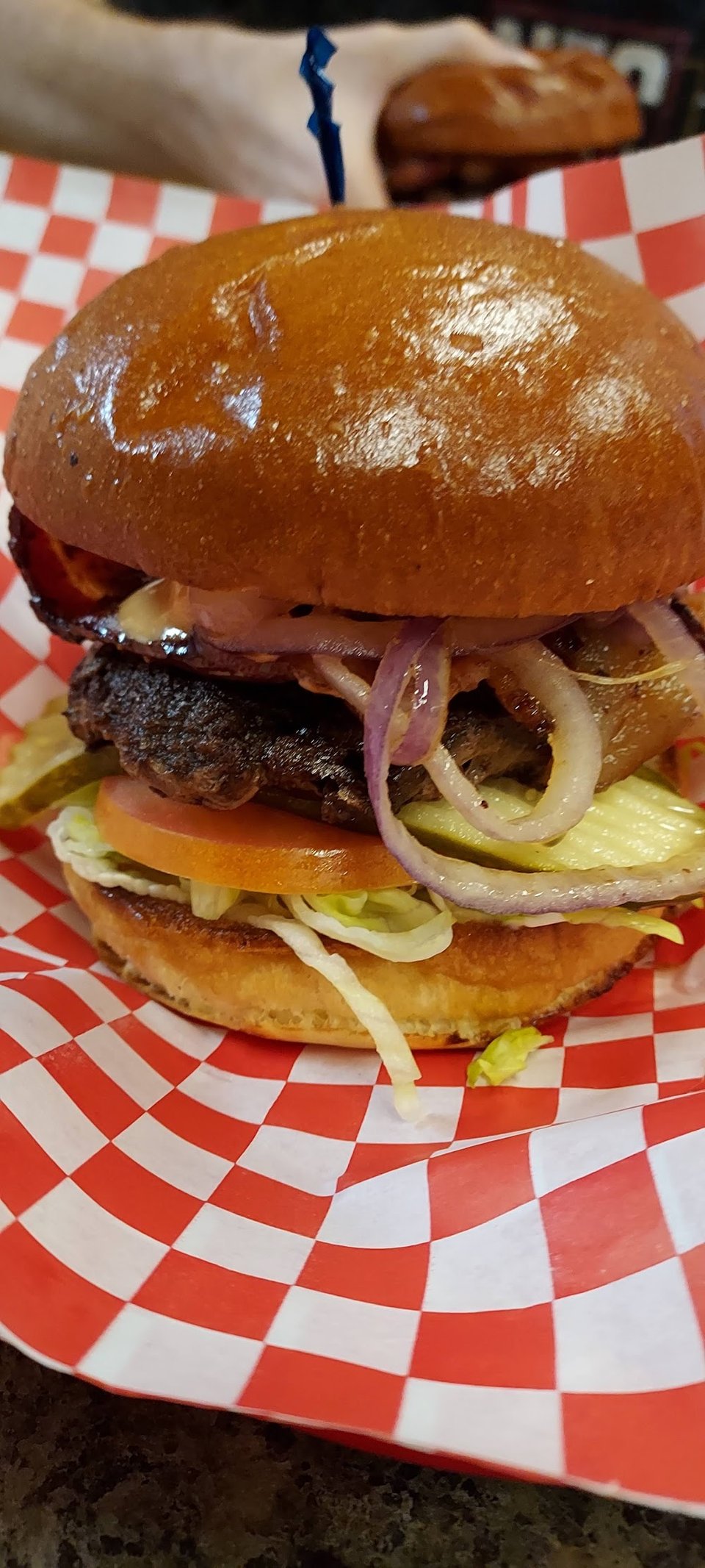 Printed menu showing burgers and lunch combos.