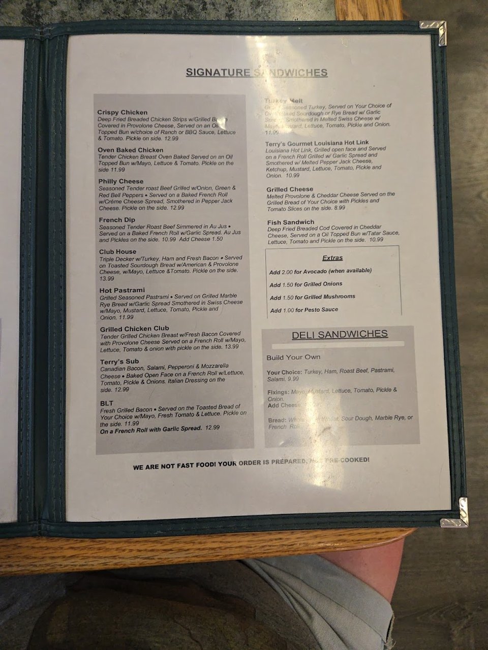 Printed menu showing burgers and lunch combos.
