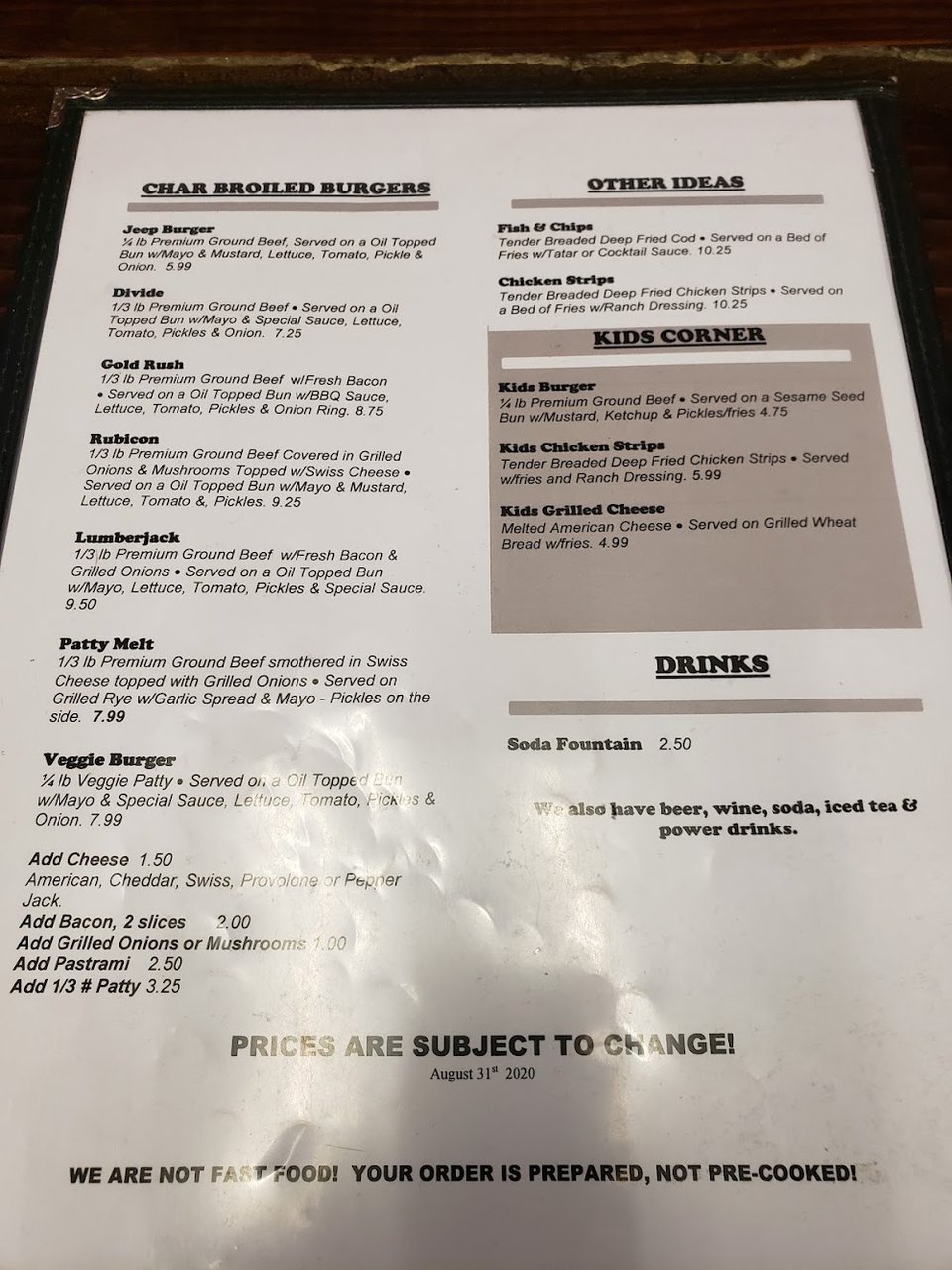 Menu board with classic grill items and pizza.