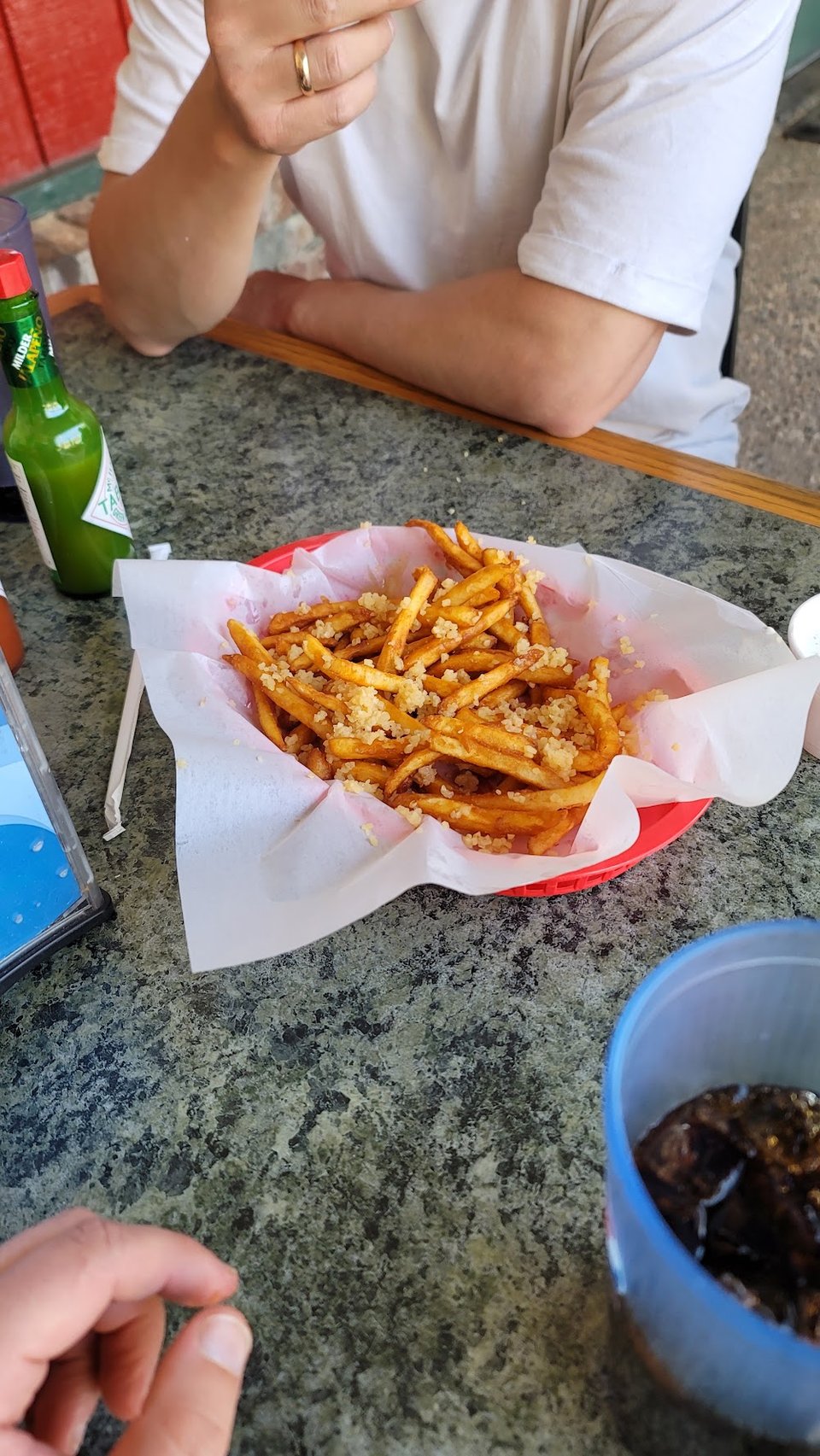 Menu page with appetizers, fries, and salads.